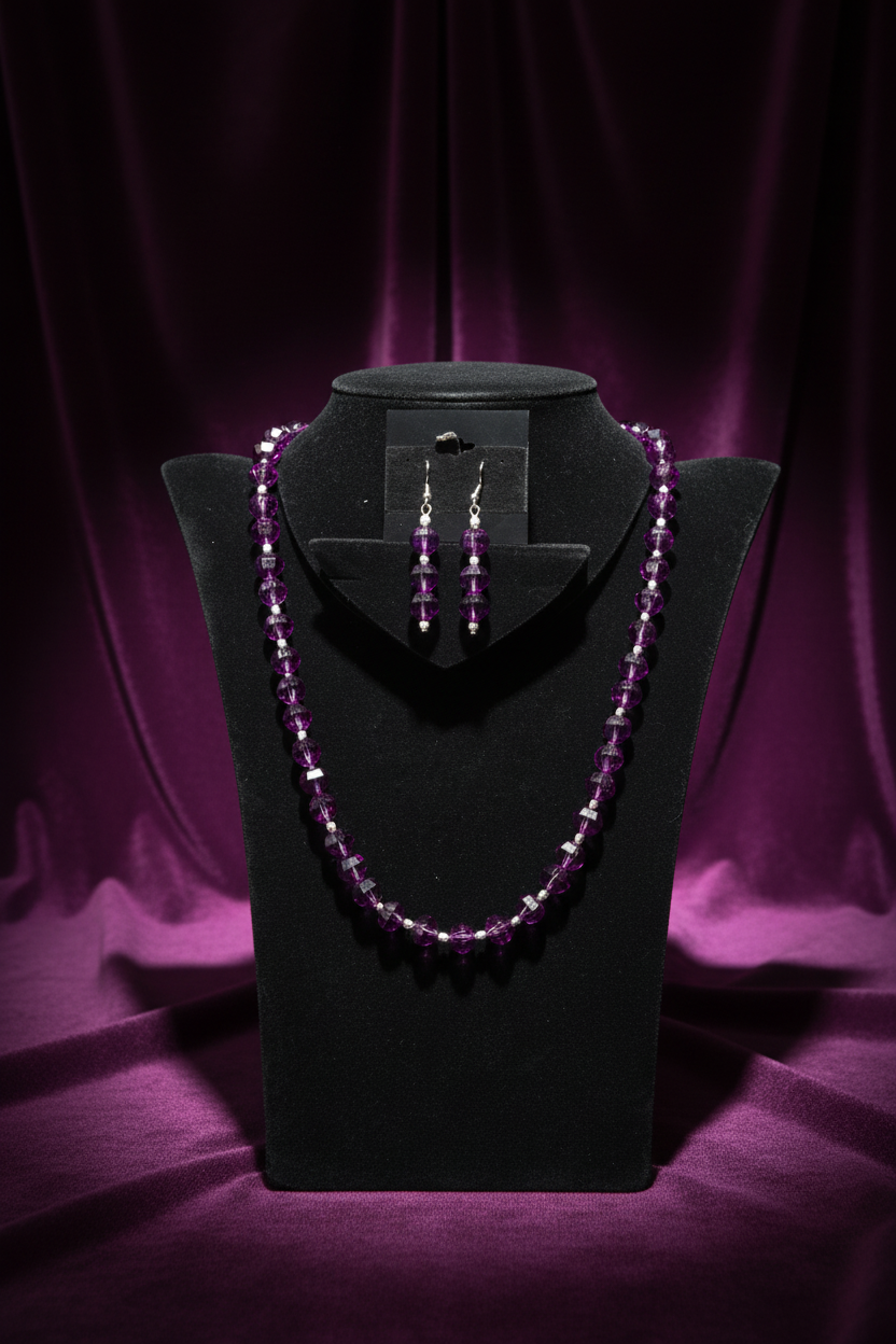 Bright purple faceted necklace set on deep plum velvet backdrop