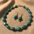 Faceted Turquoise and Silver Necklace Set on Fabric