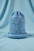 Hand-Knitted Sky Blue & White Beanie Hat - Sky Blue Background