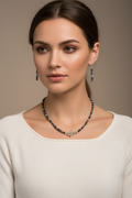Model wearing Dalmatian jasper and silver necklace and earring set