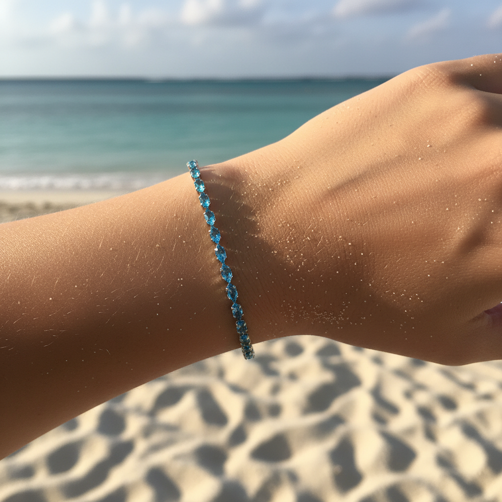 Blue topaz crystal tennis bracelet on model's wrist with second background