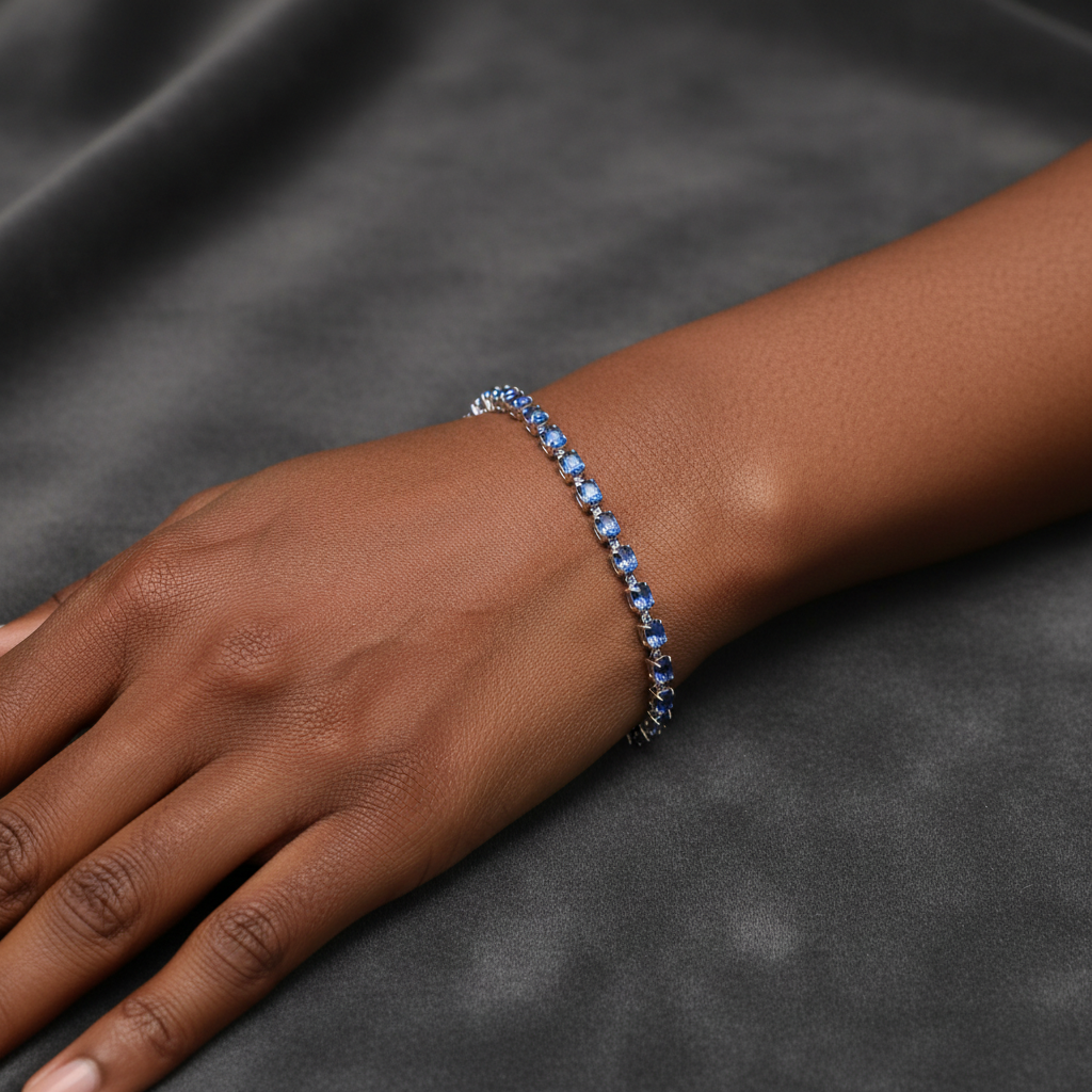 7 inch rhodium blue crystal tennis bracelet on model's wrist