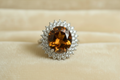 Honey gold topaz quartz halo ring on cream ivory background
