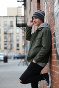 Teenage boy wearing gray charcoal slouchy striped crochet beanie