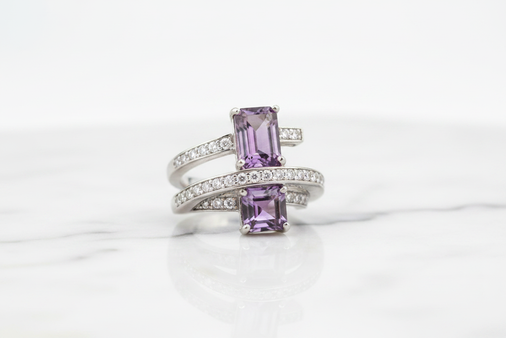 Purple quartz cocktail ring on white marble background
