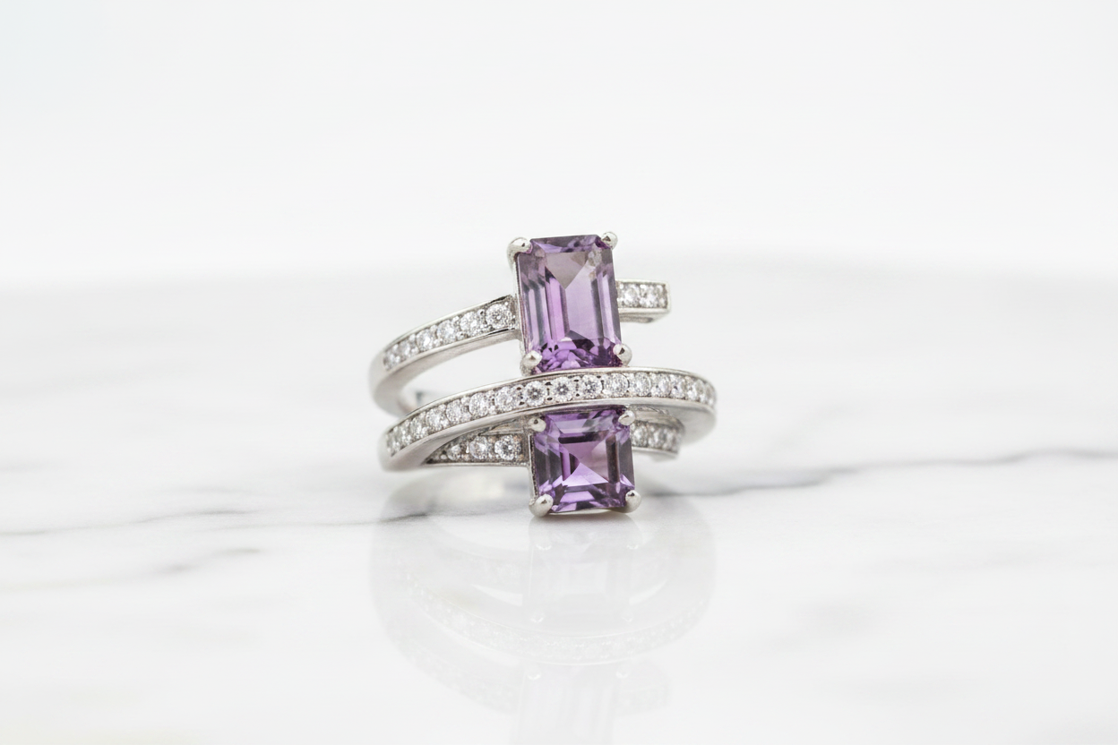 Purple quartz cocktail ring on white marble background
