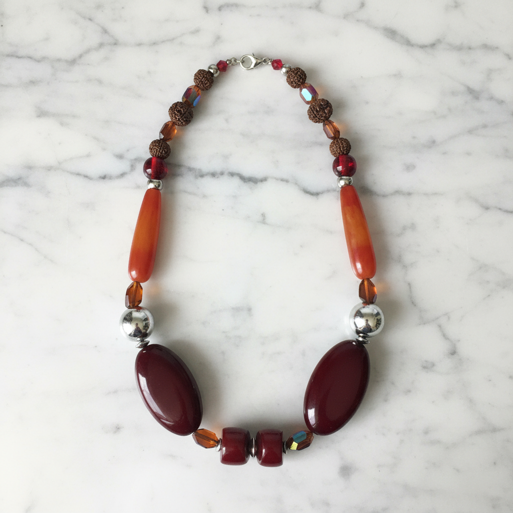 Beaded statement necklace flat lay on table