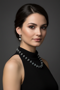 Model wearing black and crystal necklace set with matching earrings