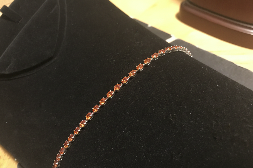 7 inch rhodium topaz crystal tennis bracelet on espresso velvet display