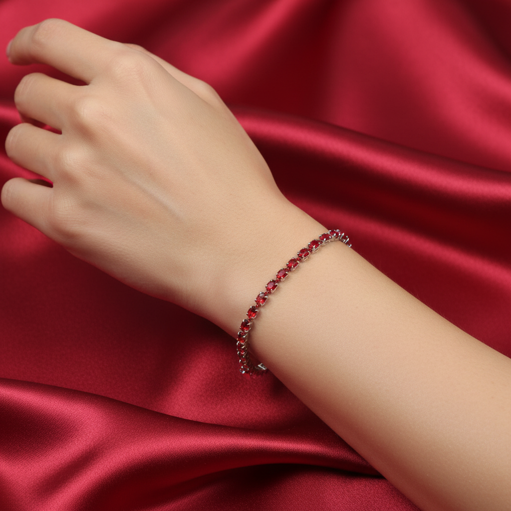 Red crystal tennis bracelet worn on model's wrist
