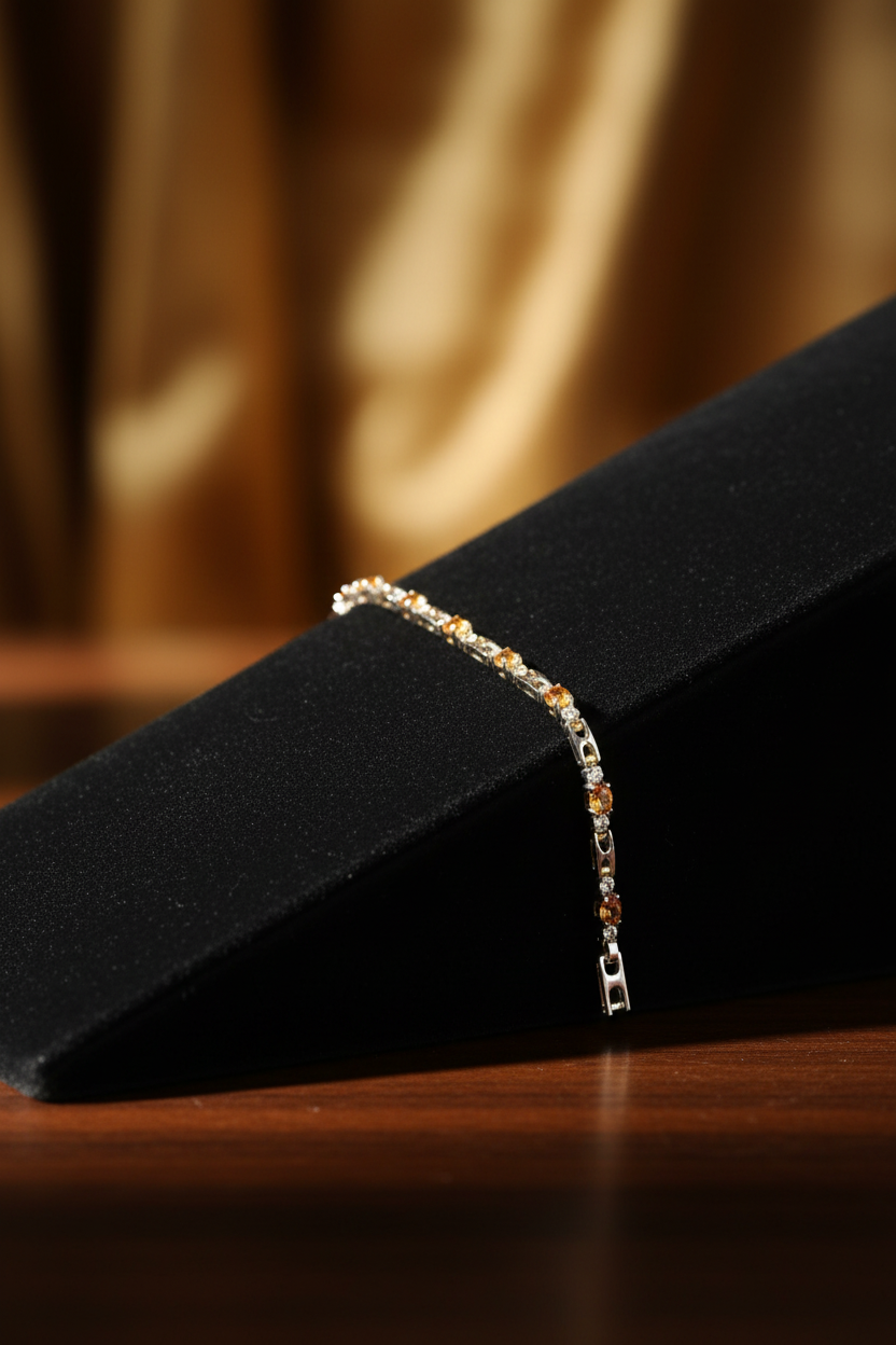 8 inch golden topaz and clear crystal 14K gold plated tennis bracelet on jewelry display ramp