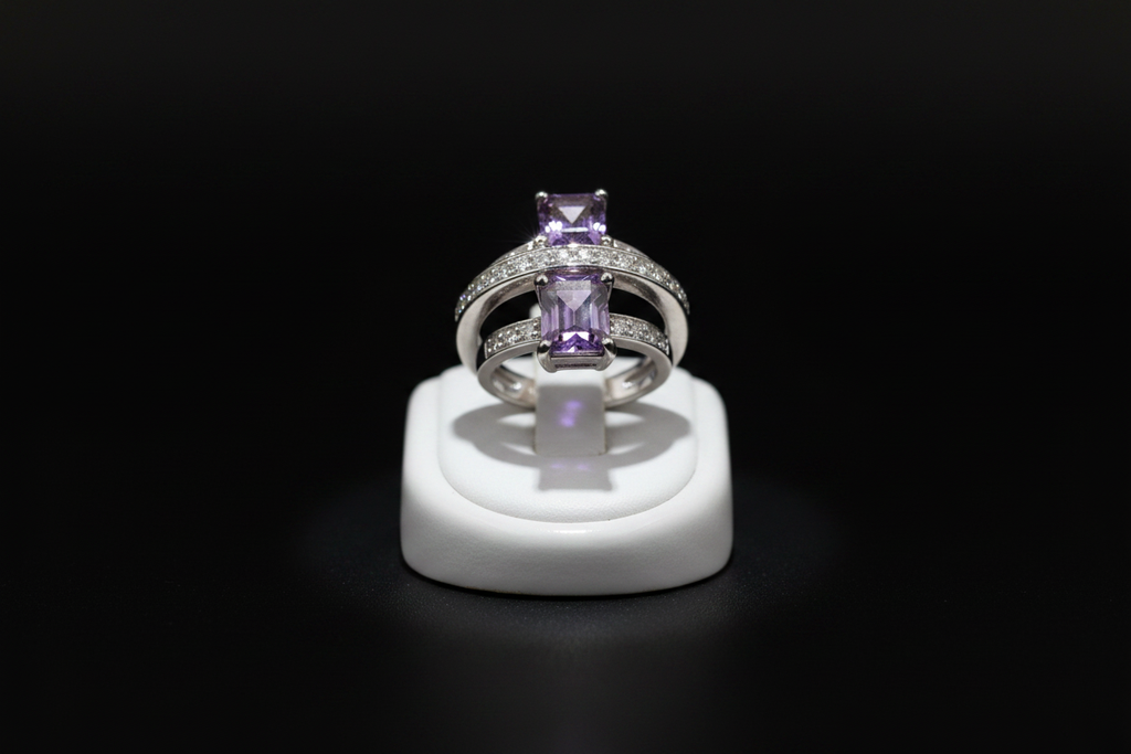 Purple quartz cocktail ring on jewelry display stand with black background