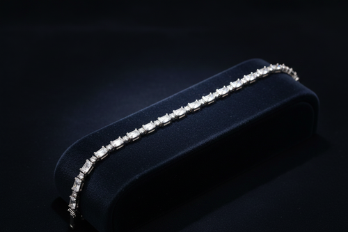 Clear crystal tennis bracelet on dark velvet ramp display