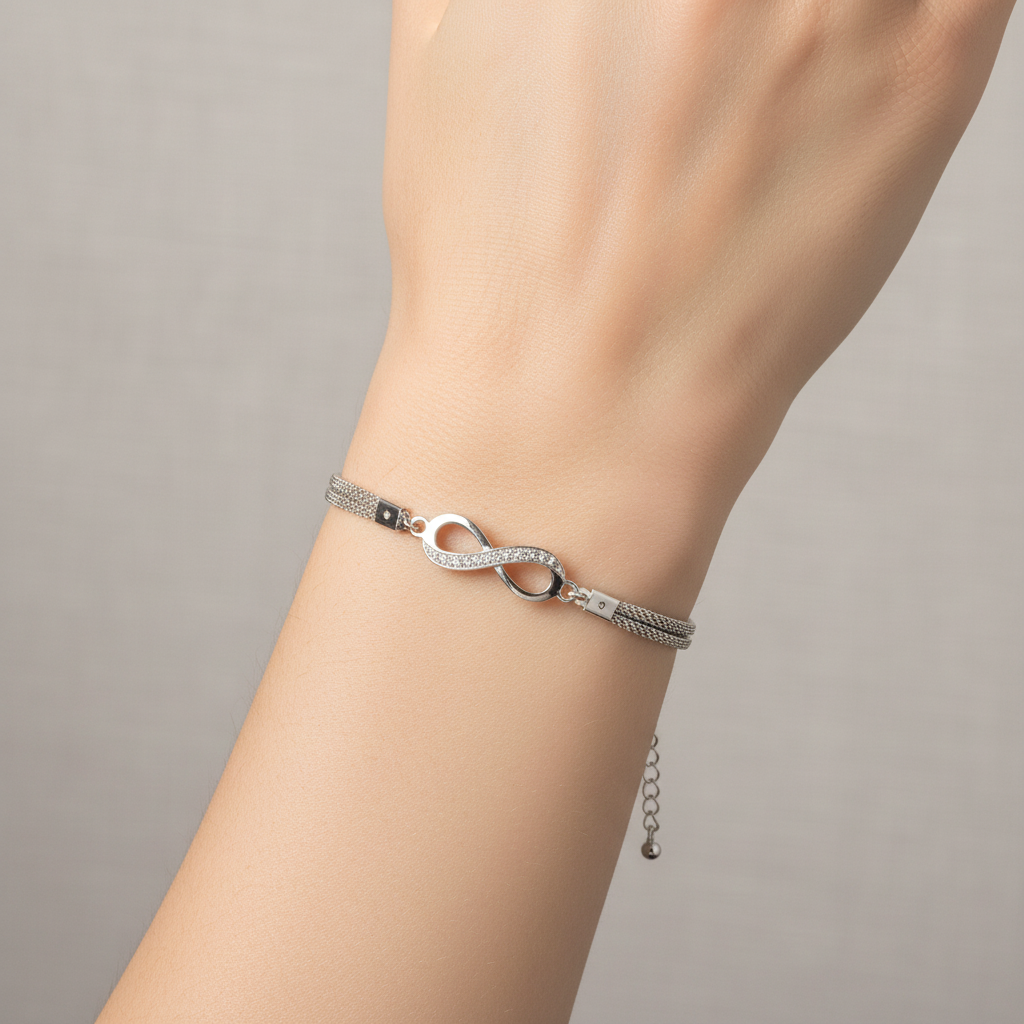 Infinity bracelet on model showing crystal charm detail