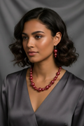 Metallic magenta necklace on model with matching drop earrings