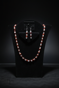 Red black orange glass bead set on black velvet display