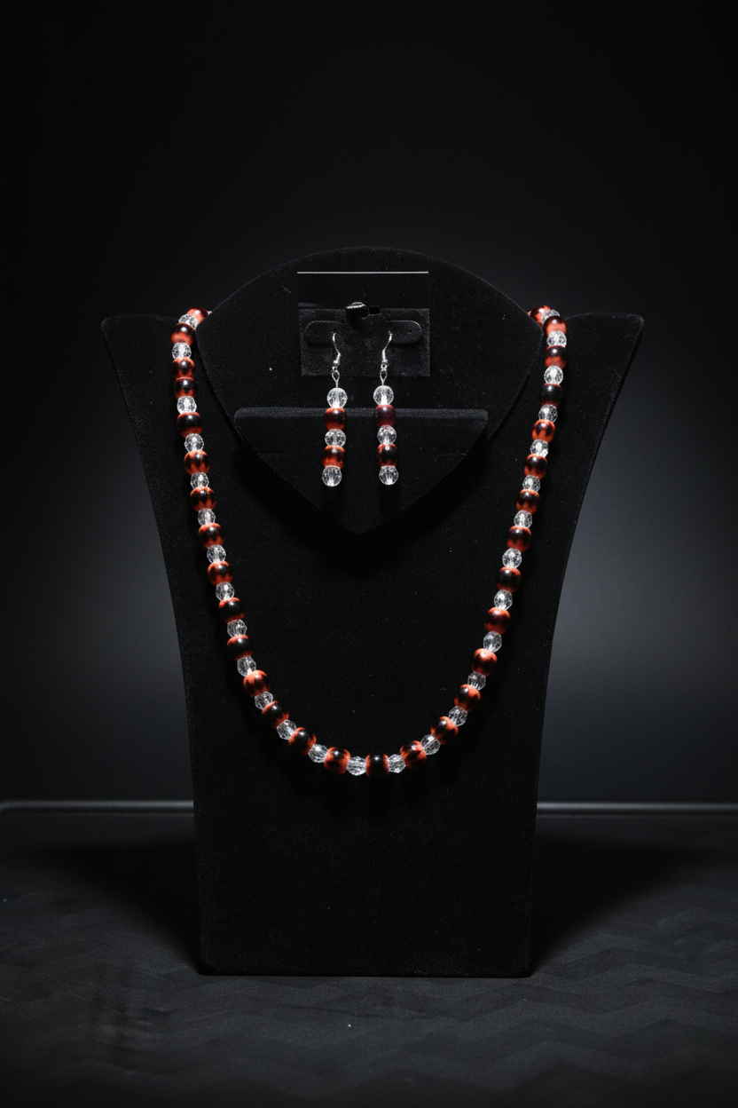 Red black orange glass bead set on black velvet display