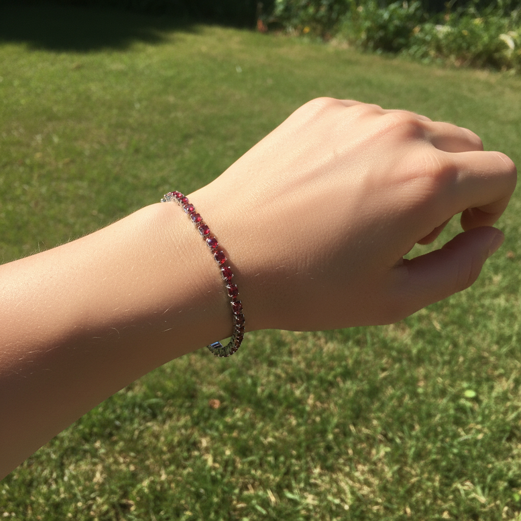 Red Crystal Tennis Bracelet on Grassy Area