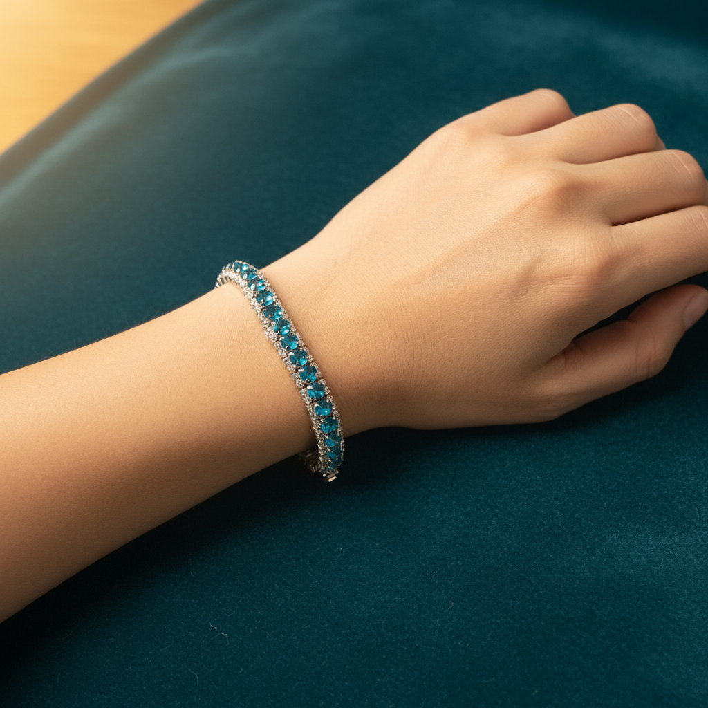 Teal crystal bracelet on model with teal velvet background